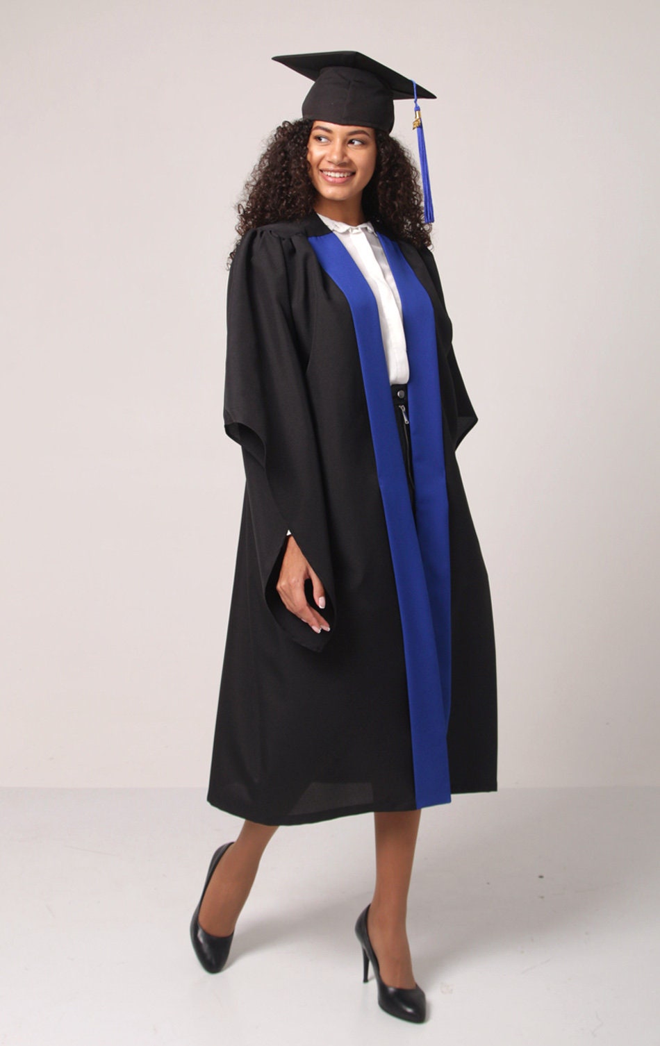 Man in White Long Sleeve Shirt and Blue Graduation Gown · Free Stock Photo