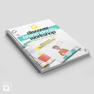 May include: A spiral bound workbook titled "discover brand identity workshop" with the text "WITH ARTISH DESIGN" in smaller font. The cover is white with teal and yellow accents. A smaller booklet with the same title and design is partially visible on top of the workbook.