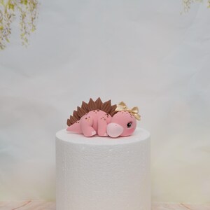 Baby Girl Dinosaur Cake Topper Made of Lightweight Air Dry Clay: Triceratops, T-rex, Brontosaurus, Stegosaurus, For Birthday Cake Pink Stegosaurus