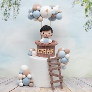 Baby boy or girl with balloons cake topper made of air dry clay