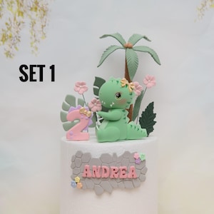 Baby Girl Dinosaur Cake Topper Made of Lightweight Air Dry Clay: Triceratops, T-rex, Brontosaurus, Stegosaurus, For Birthday Cake Set 1 w/ Green Trex