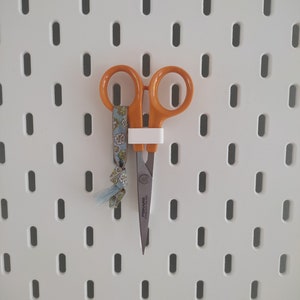 Scissors holder for IKEA Skadis pegboard. Hanging scissors mount sewing accessory.