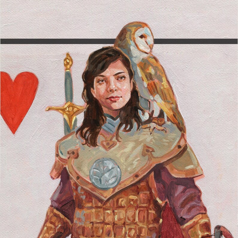 May include: A painting of a woman in armor with a sword and an owl perched on her shoulder. The woman has brown hair and is wearing a gold and burgundy colored breastplate. A red heart is in the background.
