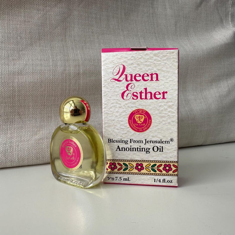 May include: A small bottle of Queen Esther anointing oil, blessing from Jerusalem, with a pink and gold label. The bottle is 7.5 ml or 1/4 fl. oz.