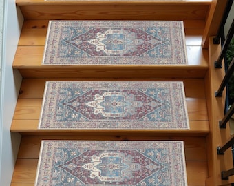 May include: Three patterned stair treads with a blue, red, and cream color scheme. The treads are made of a soft, non-slip material and are designed to add a touch of elegance to any staircase.