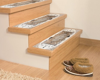 May include: A set of three non-slip stair treads with a brown and white patterned design. The treads are placed on wooden stairs. A pair of brown slippers are on the floor below the stairs.