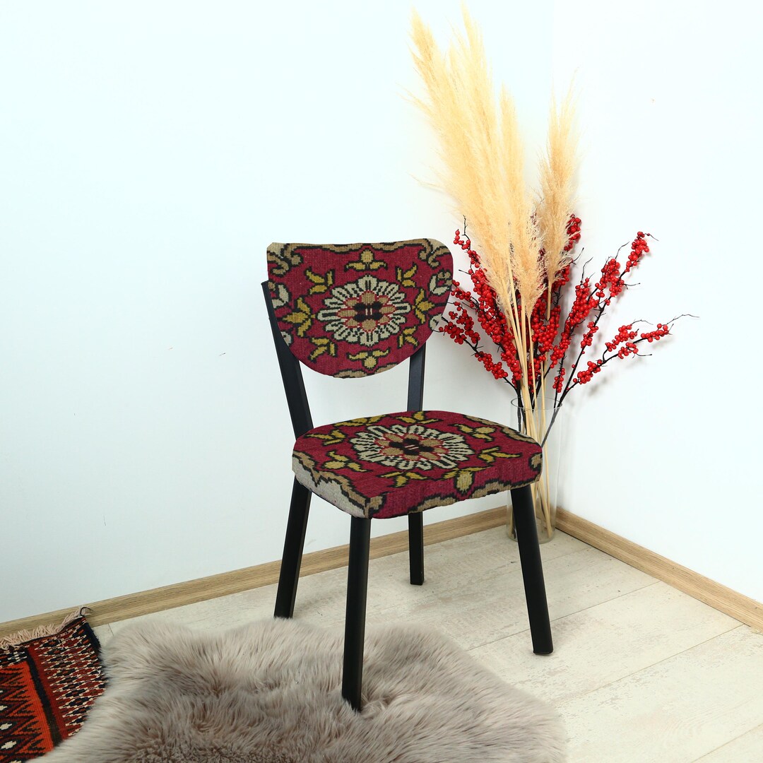 Chair With Dark Red Fabric Featuring Floral and Ornamental Motifs in ...