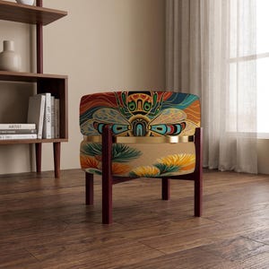 May include: A low-profile armchair with a rounded backrest featuring a colorful insect graphic in shades of orange, teal, and yellow. The seat is upholstered in a tan fabric with a floral pattern, supported by a dark wood frame and a gold band.