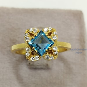 Swiss Blue Topaz Engagement Ring: 14K Yellow Gold, CZ Diamond Accents
