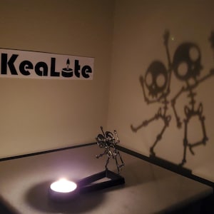 KeaLite Spooky Dancing Skeletons Caster (Tealight candles sold separately) *Buy Any 2 KeaLites & Get Free Shipping!*