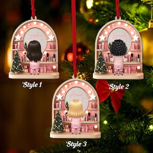 May include: Three personalized Christmas ornaments. Each ornament features a woman in a pink striped outfit, seated at a vanity with makeup and a small Christmas tree. The names "Sophia", "Brenda", and "Anna" are displayed.