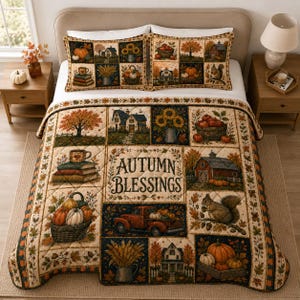 May include: A quilted bedspread and two matching pillow shams featuring a patchwork design with autumn themes, including pumpkins, sunflowers, a red truck, a barn, a squirrel, and books. The centre panel displays the text Autumn Blessings.