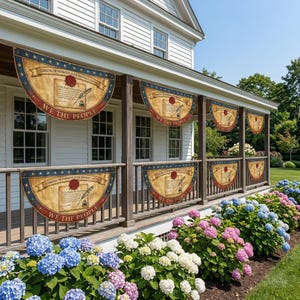 May include: A series of patriotic banners with a vintage design, featuring the text "WE THE PEOPLE" and a depiction of the U.S. Constitution. The banners are displayed on a porch railing, with a backdrop of a white house and colorful hydrangeas.
