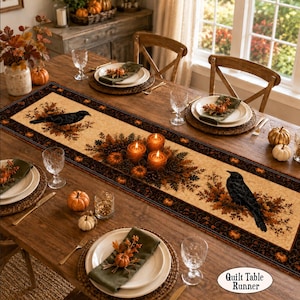 May include: A rectangular table runner featuring a cream-colored center with a repeating pattern of black crows perched on brown autumn leaves and orange pumpkins. The runner has a dark brown border with small orange pumpkin motifs throughout.