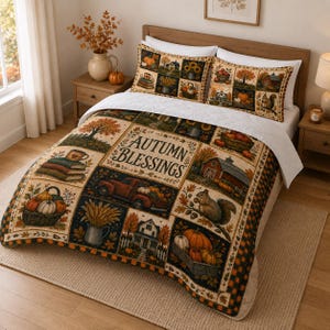 May include: A quilt and two pillow shams featuring a patchwork design with autumn-themed illustrations including pumpkins, a red truck, a barn, a squirrel, and wheat. The centre panel displays the text AUTUMN BLESSINGS in a dark brown font.