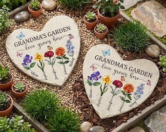 May include: Two heart-shaped stone garden markers featuring the text "GRANDMA'S GARDEN love grows here" with colorful floral illustrations and the names Olivia, Sophia, Jennifer, Johnson, and Kelsey printed below each flower stem.