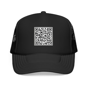May include: Black trucker hat with a white QR code graphic on the front. The hat has a curved brim and a mesh back for breathability. A classic accessory for casual wear.