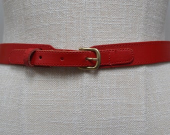 1980s Pill Box Red, shaped real leather, shaped buckle front, vintage belt.