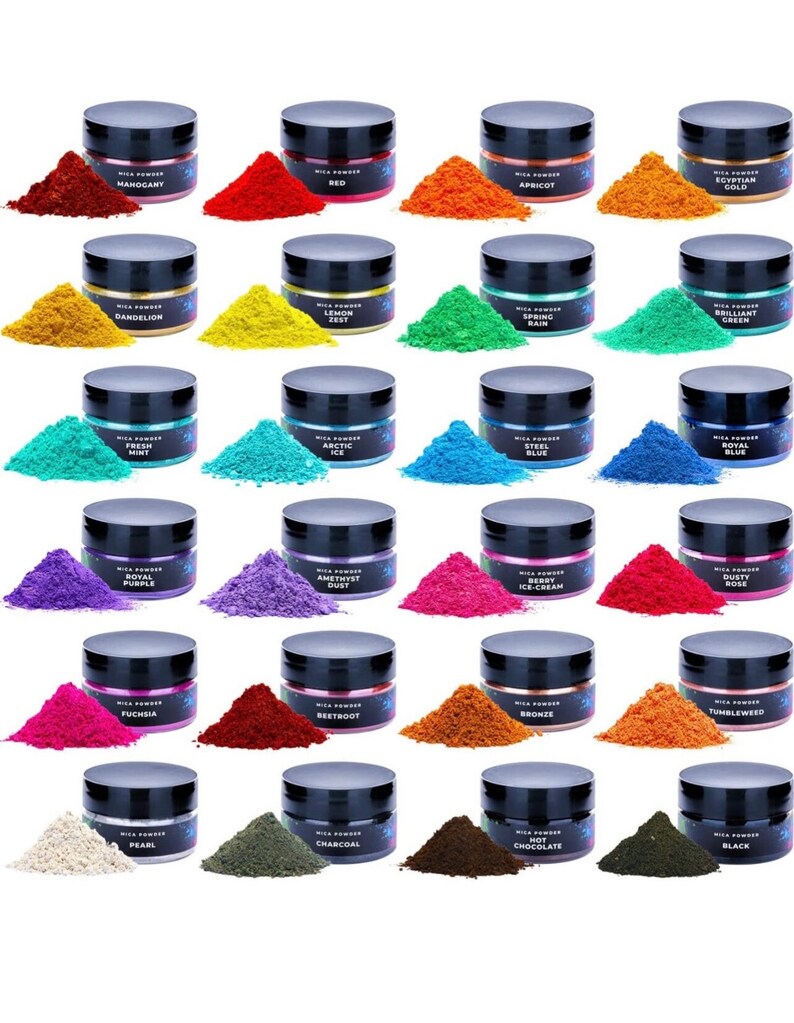 May include: A collection of 24 small jars of mica powder in various colors, including red, green, blue, purple, and gold. Each jar has a black lid and a label with the name of the color.