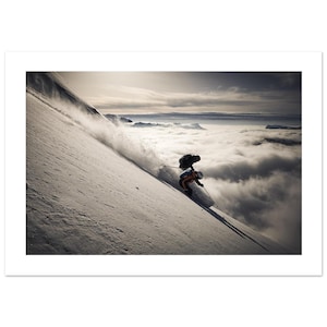 May include: A skier carves down a snow-covered mountain slope, kicking up a cloud of snow. The skier wears an orange and black outfit and skis with poles. A sea of clouds fills the valley below, with a bright sky above.