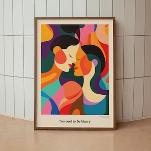Può includere: Una stampa d'arte astratta incorniciata con due figure in uno stile geometrico colorato. Le figure si baciano e la stampa ha il testo "Too cool to be binary".