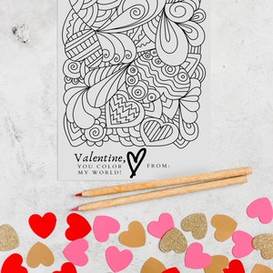 Image of a 4x6 valentine featuring a heart filled image for your valentine to color.  Valentine is primarily black and white. Image background is a heart confetti and colored pencils. By Titles and Jotters.