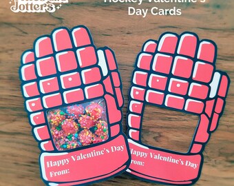 May include: Two red and white hockey glove shaped Valentine's Day cards with a window for treats. The cards say "Happy Valentine's Day" and have a space for a name.