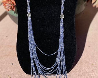 Vintage necklace of crystal beads lined in denim blue, flapper style