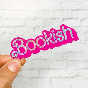 May include: Pink holographic sticker with the word "Bookish" in a bubbly font.
