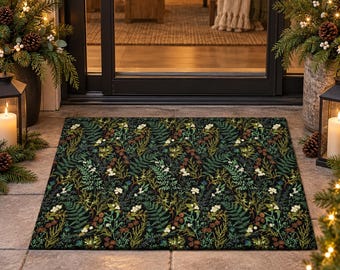 May include: A rectangular doormat featuring a dark black background with a dense, repeating botanical pattern of green fern fronds, small white flowers, brown pinecones, and various evergreen sprigs arranged in a detailed, layered composition.