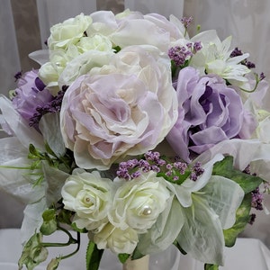 Brides' Bouquet lavender peonies, white lilies, roses, garden blooms, touch of Pearls. Special Price includes FREE Boutonniere .