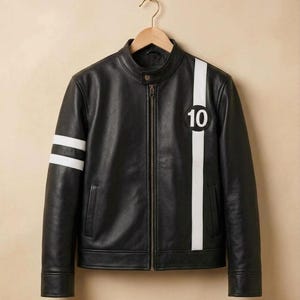 May include: A black jacket with a stand-up collar and a full-length front zip. The garment features a vertical white stripe on the left chest with a circular patch containing the number 10, and two horizontal white stripes on the right sleeve.