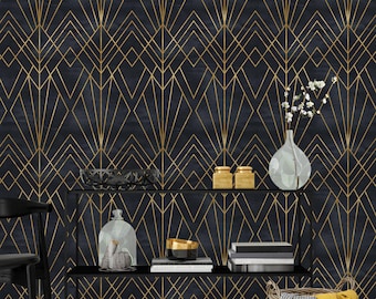 May include: A black and gold geometric wallpaper with a modern art deco design. The wallpaper is displayed on a wall behind a black shelf with decorative items, including a glass vase, books, and a wicker basket.