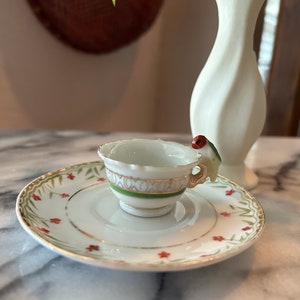 Miniature Teacup and Saucer with Parrot
