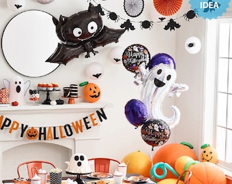 May include: A Halloween party decoration set with black bats, orange and white paper fans, and a black and white banner that reads "Happy Halloween". There are also several foil balloons, including a ghost, a bat, and a round balloon with the words "Happy Halloween" on it. The balloons are tied together with a ribbon.