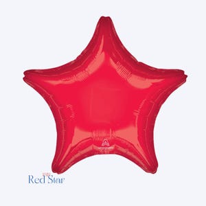 May include: A large, red, star-shaped foil balloon. The balloon is inflated and ready to be used. The balloon has a shiny, metallic finish.