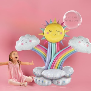 May include: A rainbow balloon arch with a smiling sun and two clouds. The arch is 4 feet tall and air-fill only. The balloons are silver with a glitter finish.