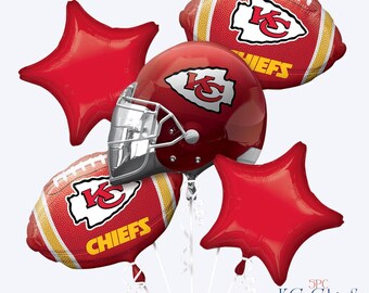 May include: A five-piece balloon bouquet featuring a central red football helmet balloon with the KC logo, two red football-shaped balloons with the KC logo and the word CHIEFS, and two solid red star-shaped balloons. Text reads 5PC KC Chief's Bouquet.