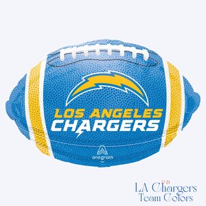 May include: A blue football-shaped balloon featuring the Los Angeles Chargers logo, a yellow lightning bolt, and the text LOS ANGELES CHARGERS in white and yellow. The balloon has white laces and yellow stripes on each end, with 17 IN printed below.