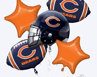 May include: A 5-piece Chicago Bears balloon bouquet featuring a dark blue football helmet with a white and orange C logo, two dark blue football-shaped balloons with the Bears logo, and two solid orange star-shaped balloons with white ribbons.