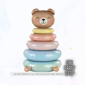 May include: A stack of 6 pastel colored foil balloon rings with a brown bear face on top. The balloon stack is 43 inches tall. The text "ONE PARTY STOP" is in the bottom right corner of the image.
