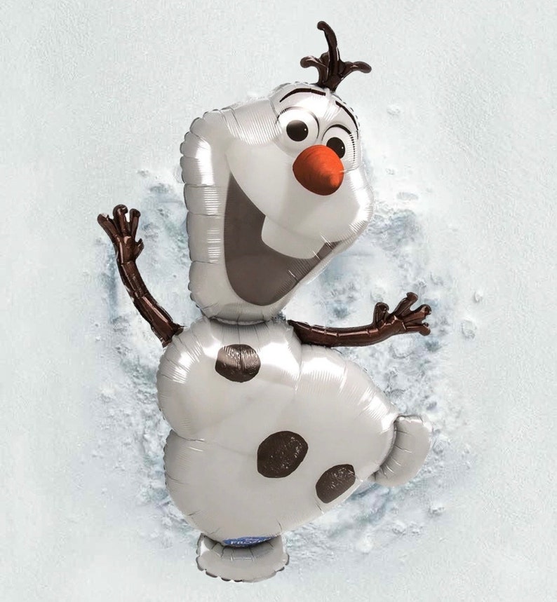 May include: A silver Olaf balloon from the movie Frozen. The balloon features a smiling face with a carrot nose, black eyes, and brown twig arms and hair. The balloon is on a white background.