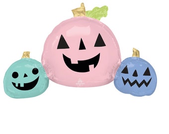 May include: Three Halloween-themed pumpkin balloons in pastel colors. The largest is pink, the smallest is blue, and the third is teal. Each has a jack-o'-lantern face with black cutouts and a gold stem.