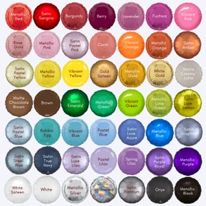 May include: A collection of round foil balloons in various colors, including red, pink, orange, yellow, green, blue, purple, and black. Each balloon has a metallic or satin finish, with text labels indicating the color names.