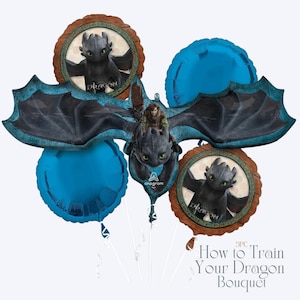 May include: A How to Train Your Dragon balloon bouquet featuring a central dragon with a rider, flanked by two round balloons with dragon images and two blue round balloons. The bouquet includes the text "How to Train Your Dragon Bouquet".