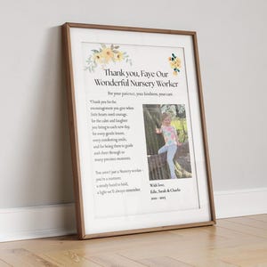 May include: Framed print with a wooden frame. The print features text that reads "Thank you, Faye Our Wonderful Nursery Worker" with a photo of a child. Floral accents and additional text are also included.