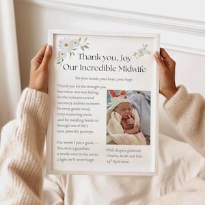 May include: A white framed print featuring floral illustrations and text thanking a midwife. The text reads: Thank you, Joy Our Incredible Midwife. For your hands, your heart, your hope. Includes a photo of a newborn in a knit hat.