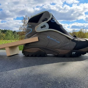 Boot puller removes wooden boots image 5