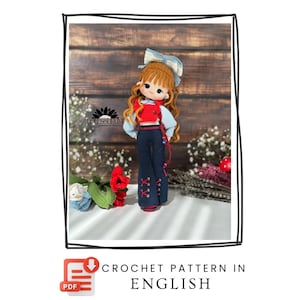 May include: A crochet doll with long wavy ginger hair, wearing a large blue and white striped bow, a red cropped vest over a light blue long-sleeved shirt, and dark blue flared trousers with red lace-up details. The text reads CROCHET PATTERN IN ENGLISH.