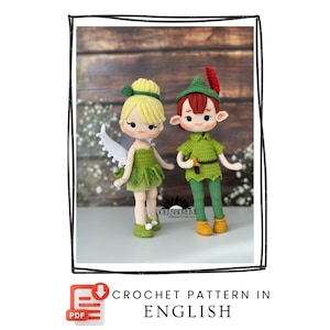 May include: Two handmade crochet dolls, a fairy and Peter Pan, stand side-by-side. The fairy wears a green dress and has white wings. Peter Pan is dressed in green with a red feather in his hat. The image includes the text "CROCHET PATTERN IN ENGLISH."